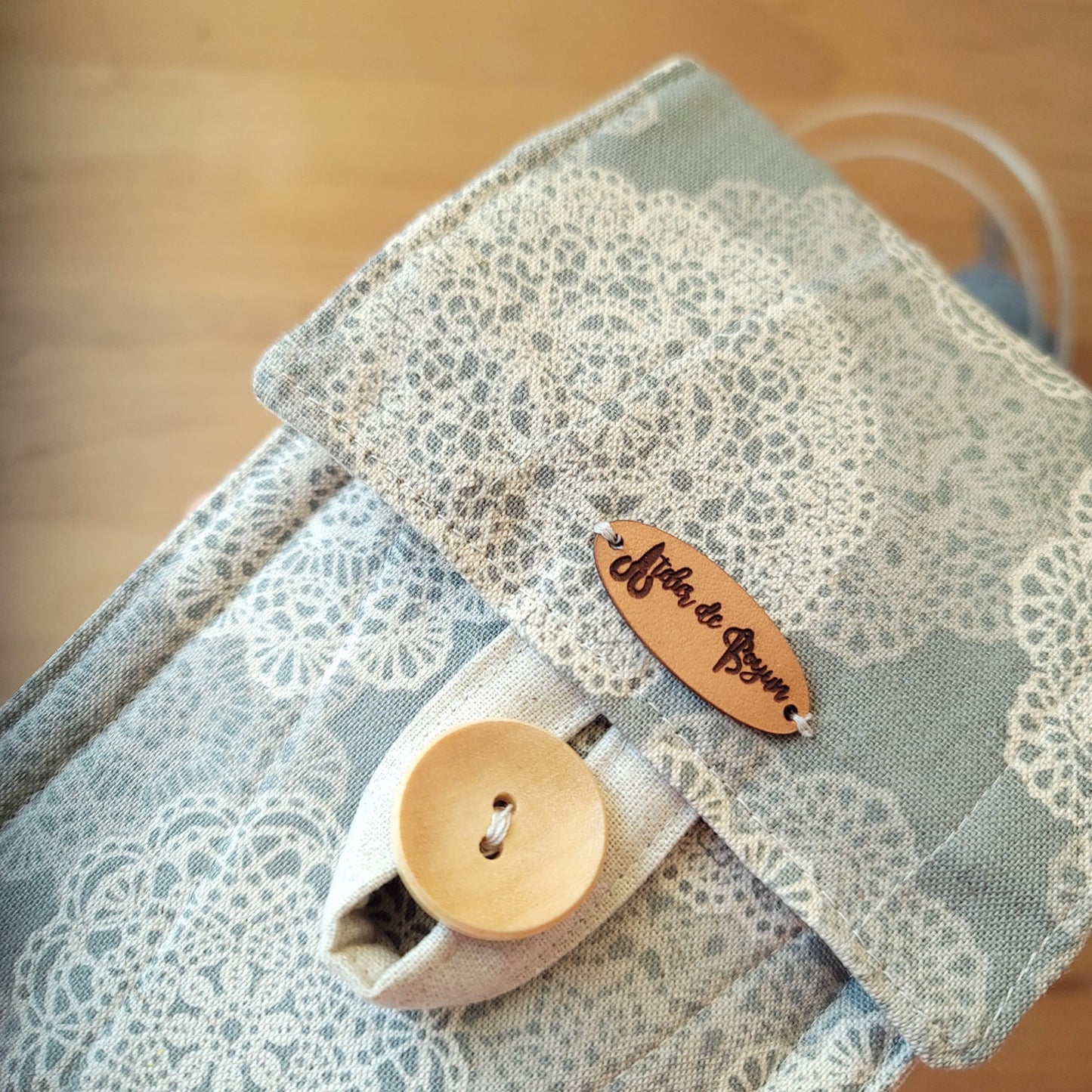 Circular knitting needle case with a zipper pocket in snow flower patters