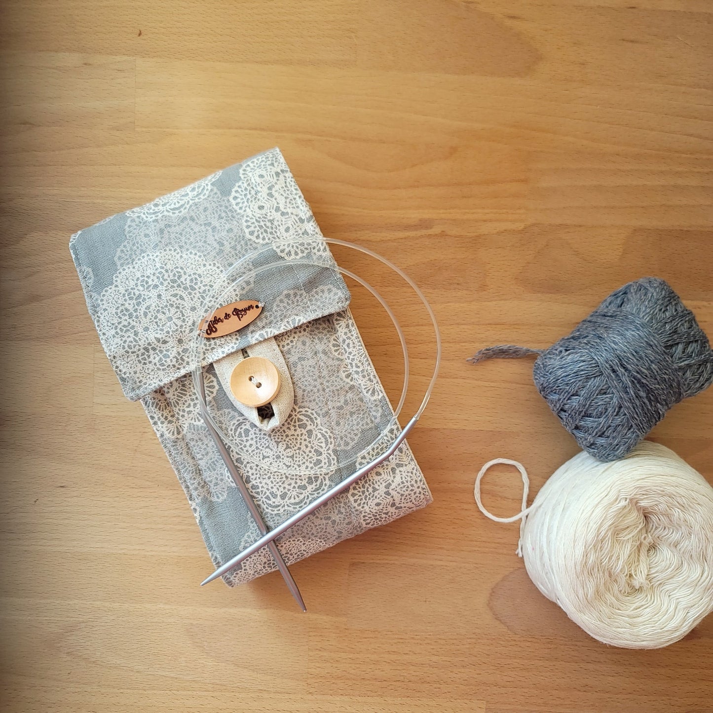 Circular knitting needle case with a zipper pocket in snow flower patters