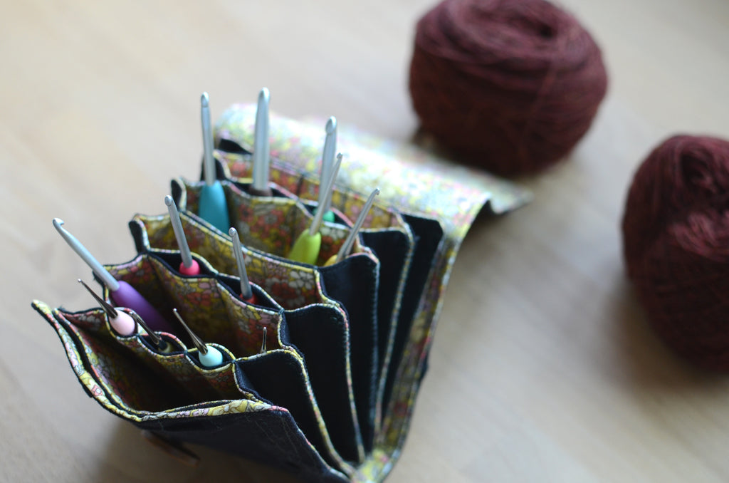 The most innovative crochet hook organizer. All sizes of crochet hooks, darn needles, tailor rulers, scissors, and stitch markers can stay all together in this fabulous crochet hook storage.