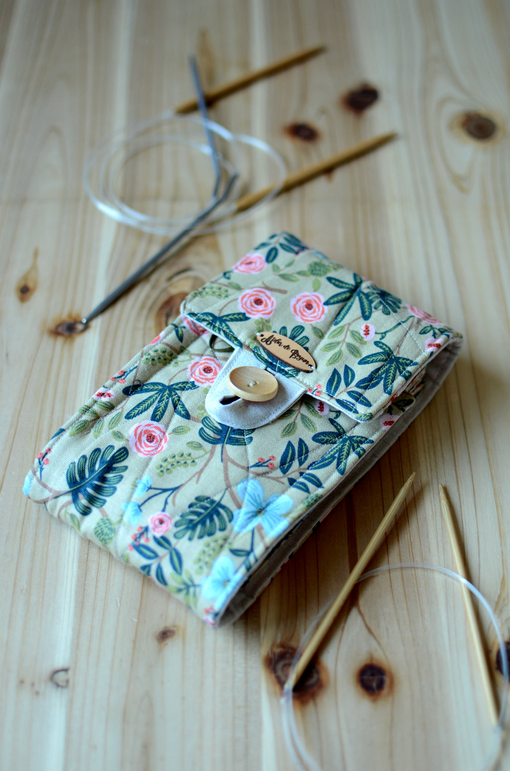 Circular knitting needle storage in mustard flower with many pockets and zipper notion pocket