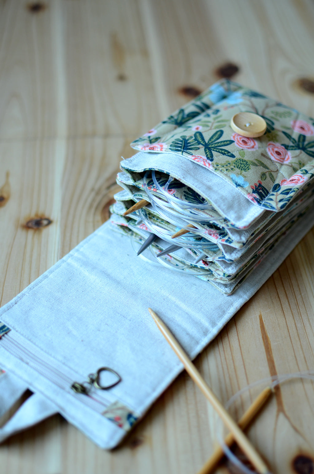 Circular knitting needle storage in mustard flower with many pockets and zipper notion pocket