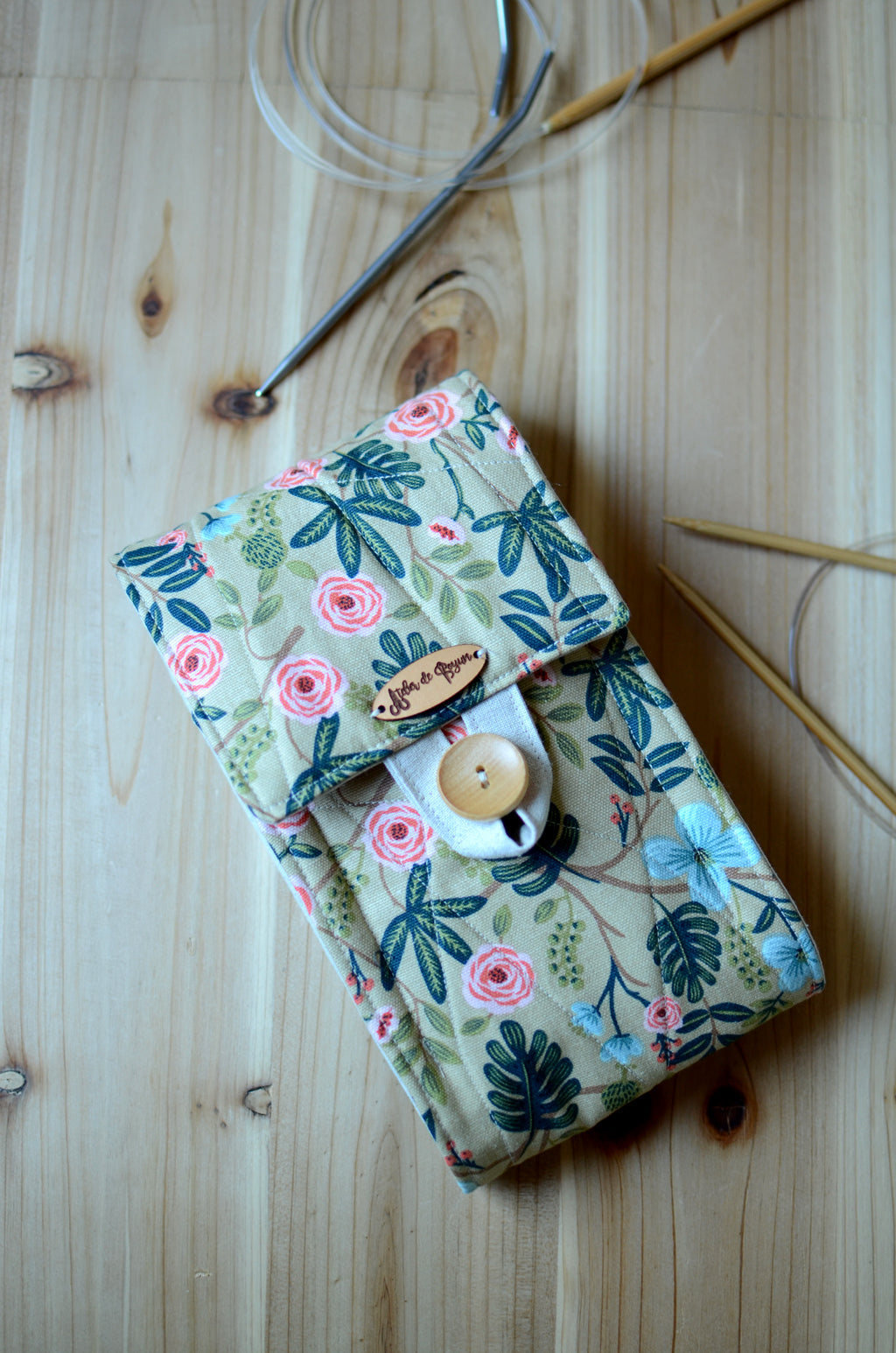 Circular knitting needle storage in mustard flower with many pockets and zipper notion pocket