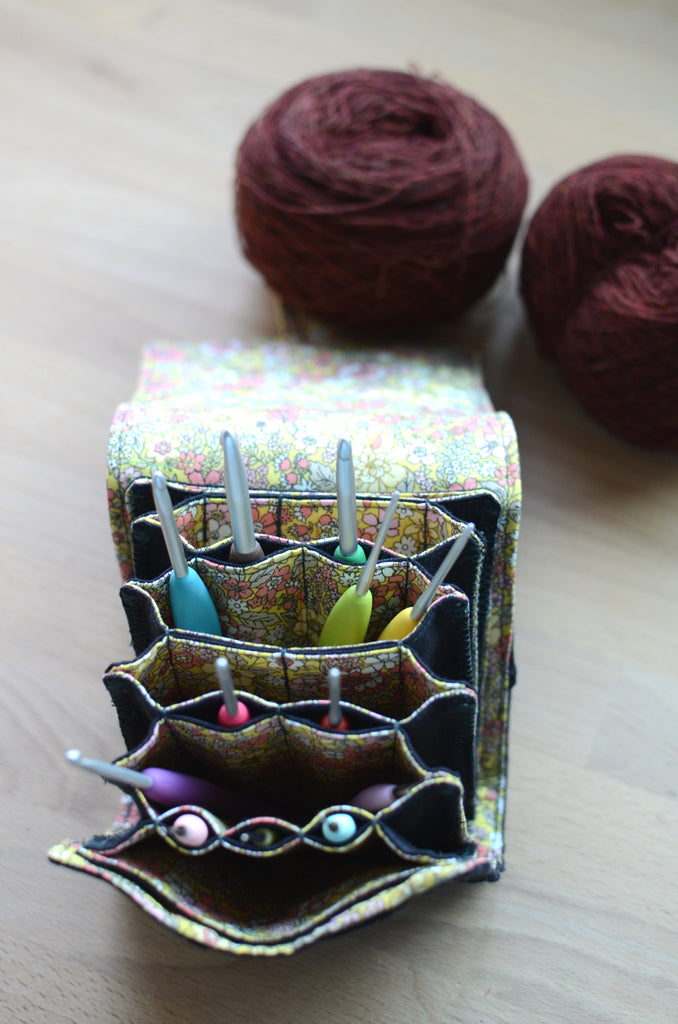 The most innovative crochet hook organizer. All sizes of crochet hooks, darn needles, tailor rulers, scissors, and stitch markers can stay all together in this fabulous crochet hook storage.