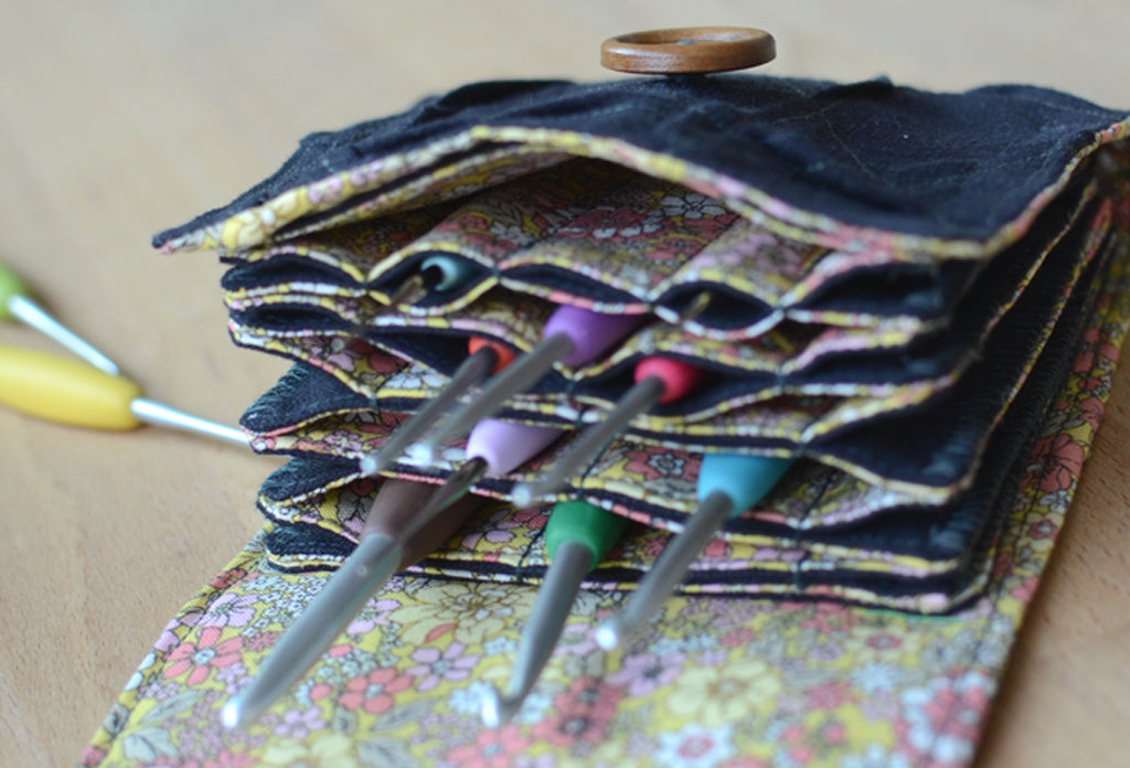 The most innovative crochet hook organizer. All sizes of crochet hooks, darn needles, tailor rulers, scissors, and stitch markers can stay all together in this fabulous crochet hook storage.