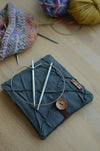 Travel knitting needle holder that carries all your knit necessities and more. Perfect summer vacation knitting bag.