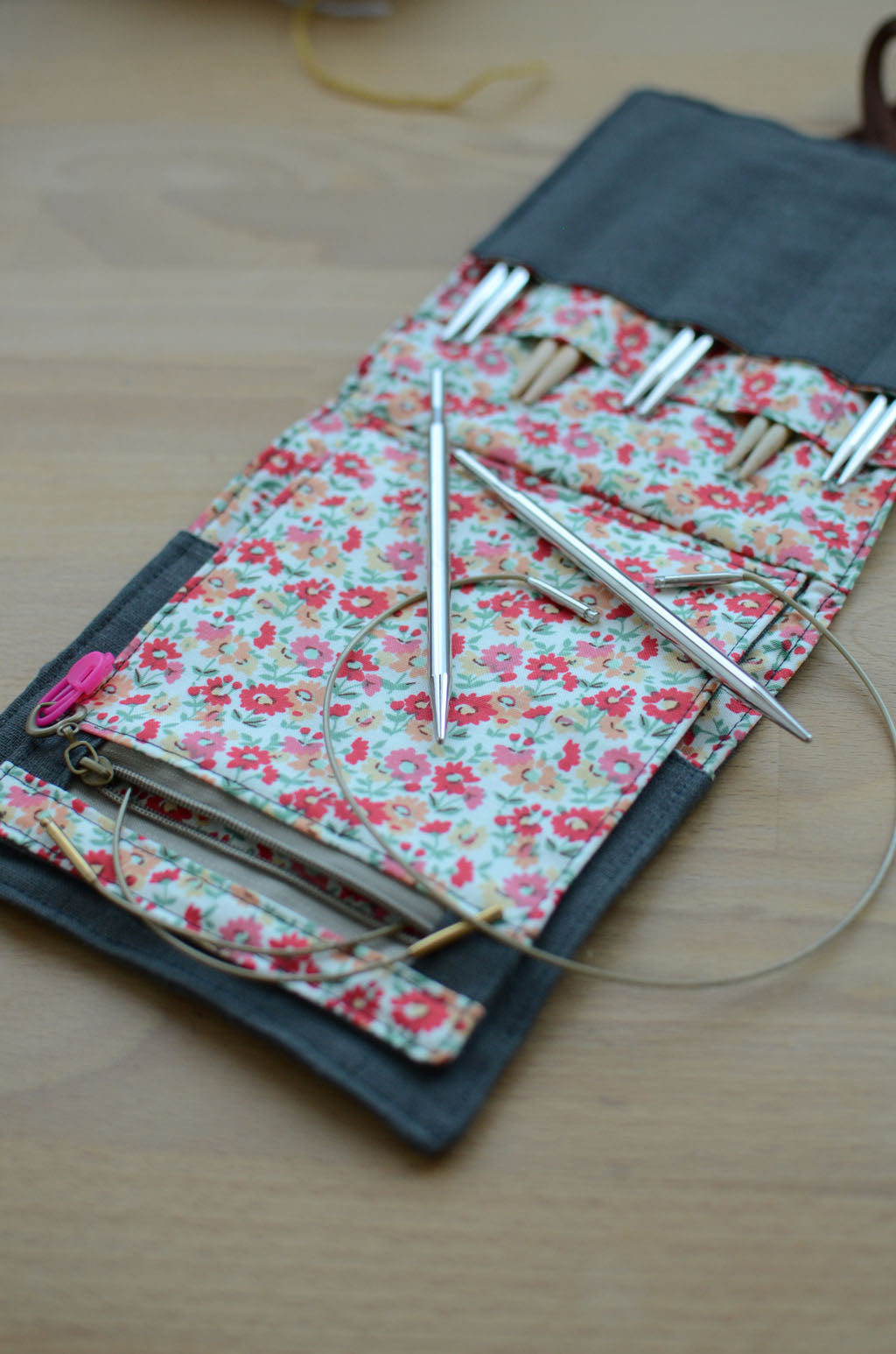 Travel knitting needle holder that carries all your knit necessities and more. Perfect summer vacation knitting bag.