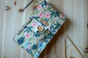 Circular knitting needle storage in mustard flower with many pockets and zipper notion pocket