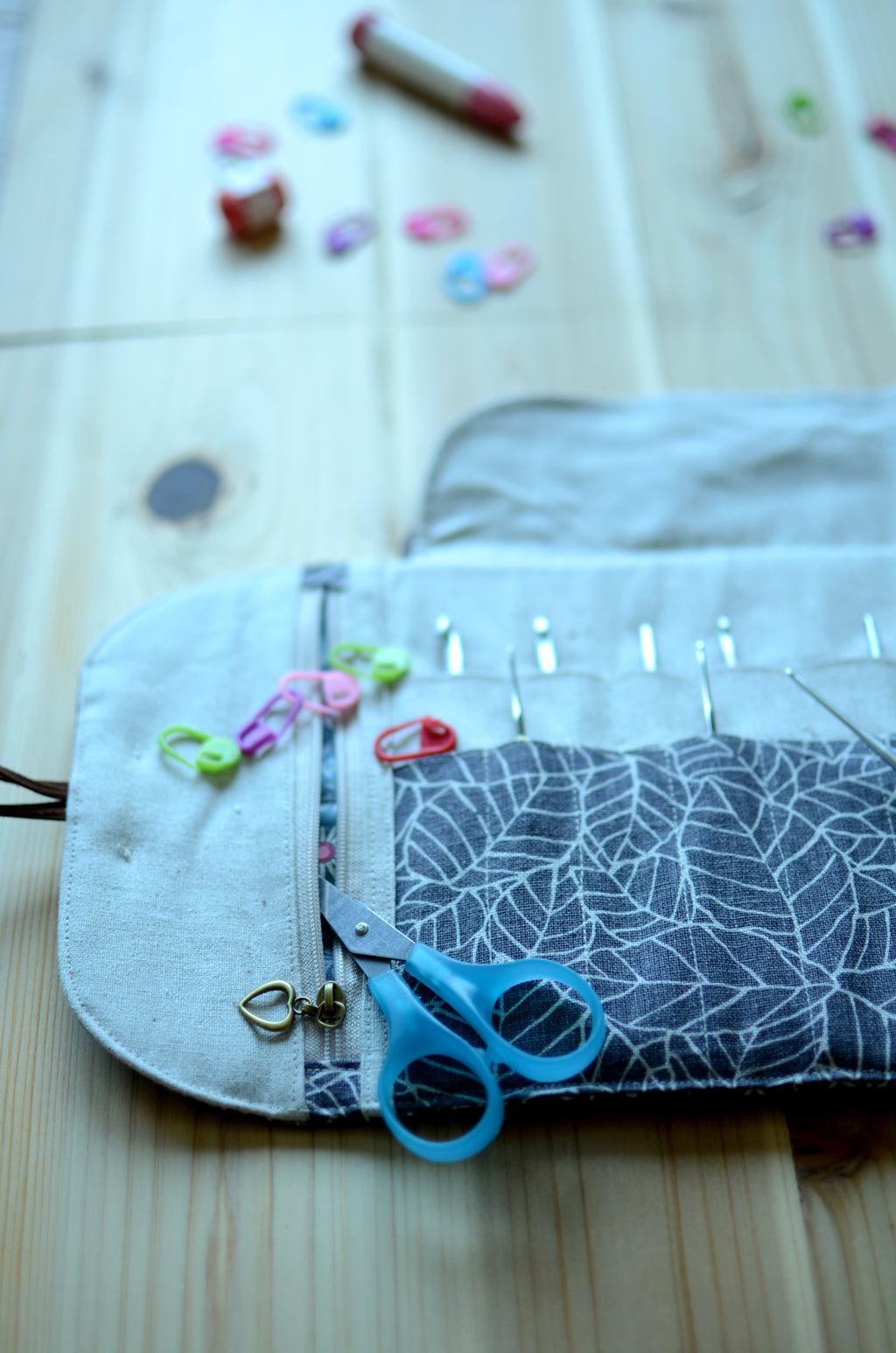 Crochet hook storage in natural linen with a built-in zipper pocket