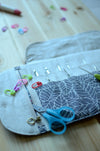 Crochet hook storage in natural linen with a built-in zipper pocket