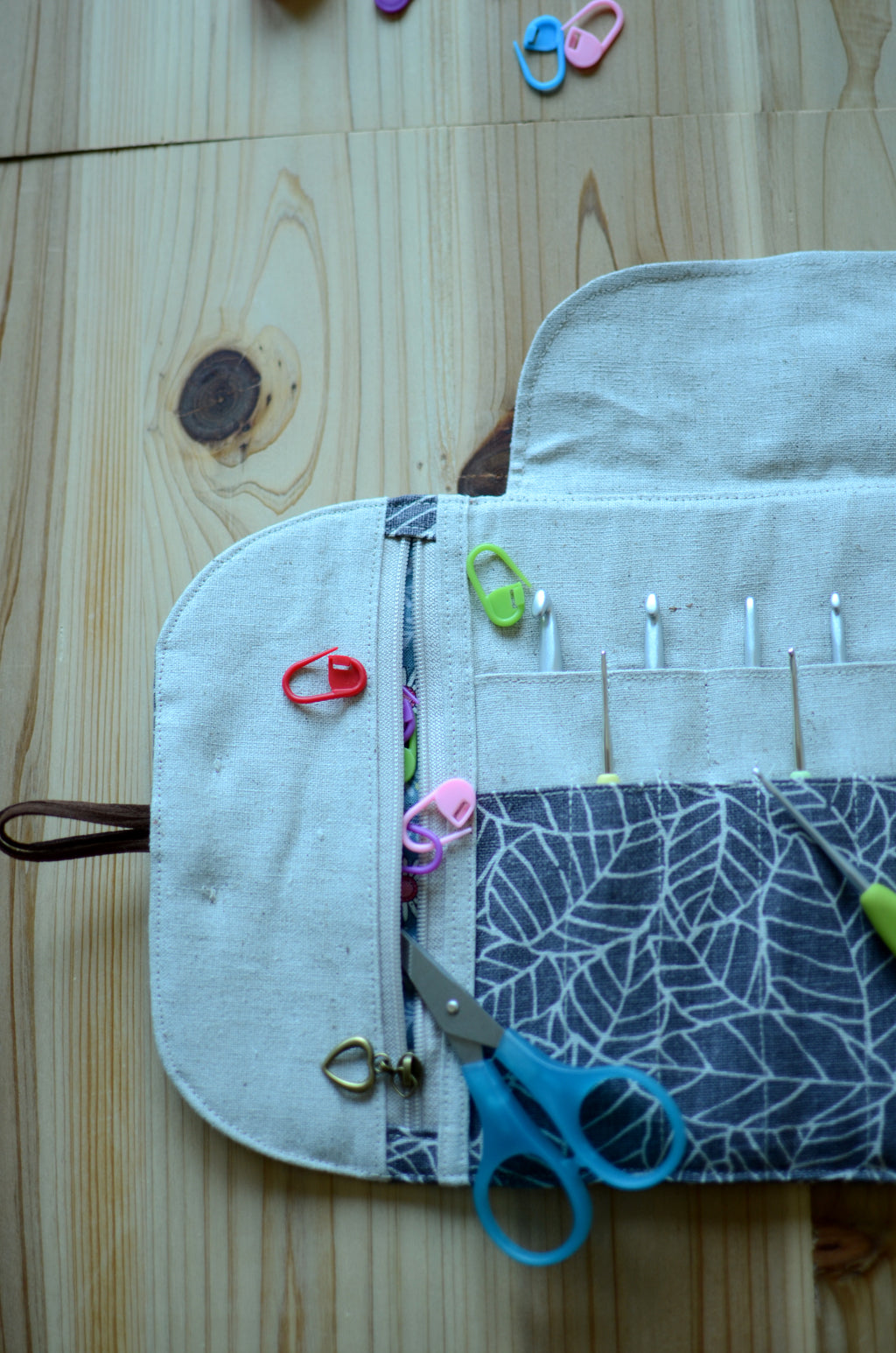 Crochet hook storage in natural linen with a built-in zipper pocket