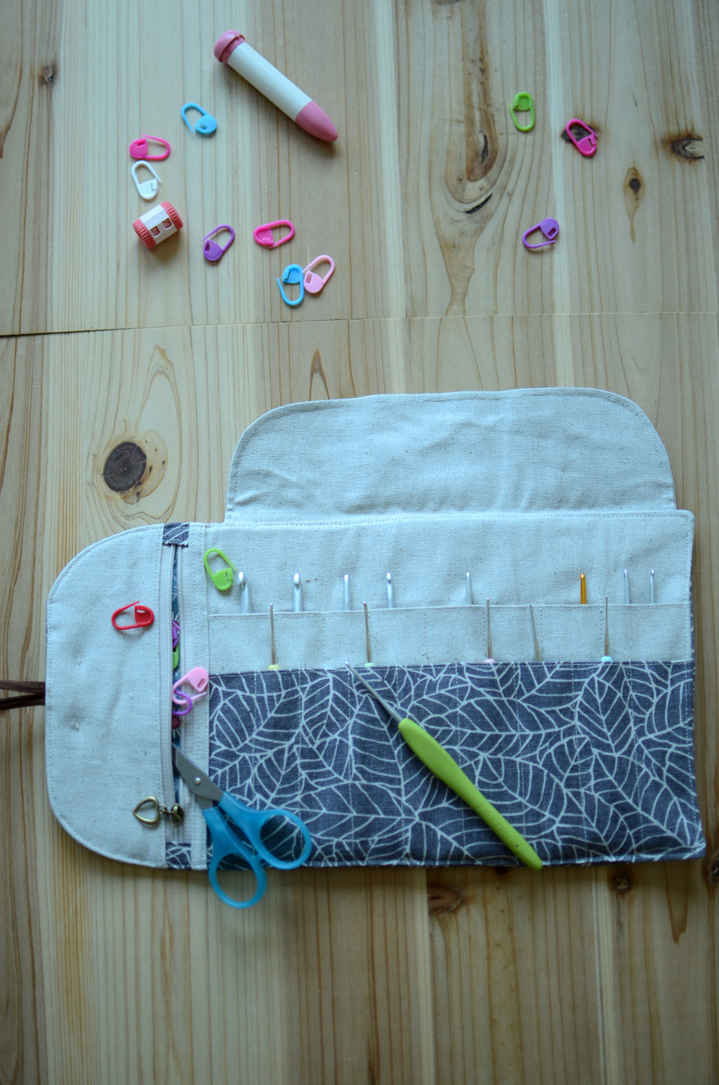 Crochet hook storage in natural linen with a built-in zipper pocket