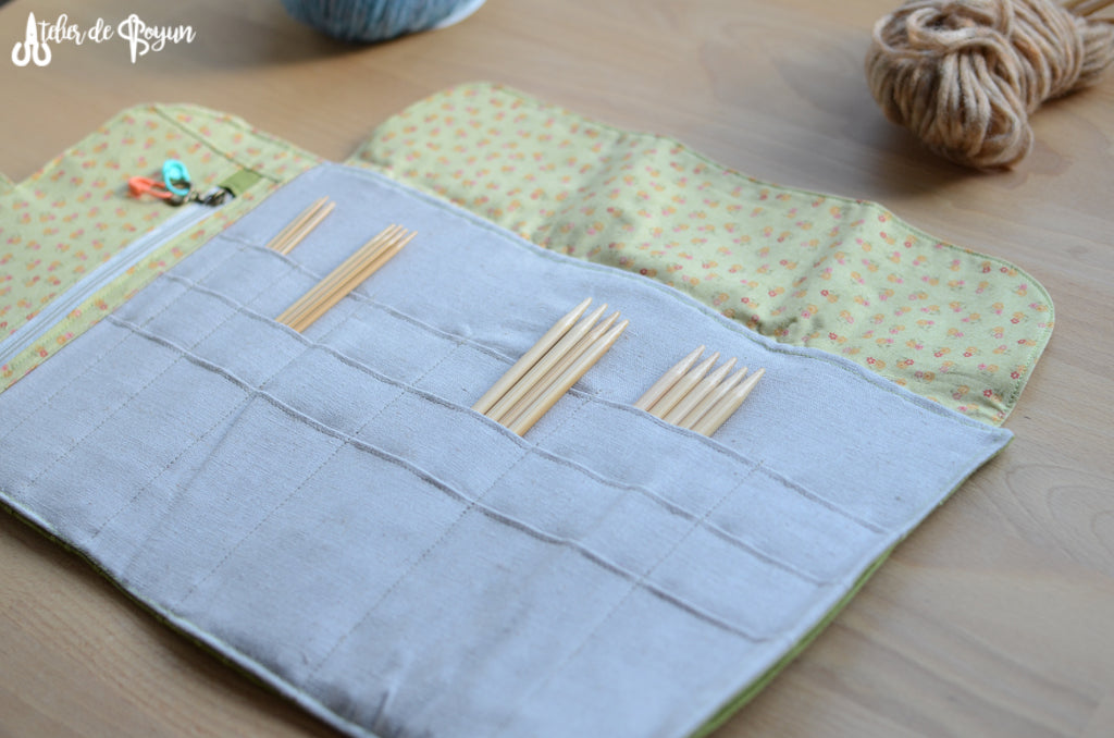 knitting needle organizer with a zipper pocket