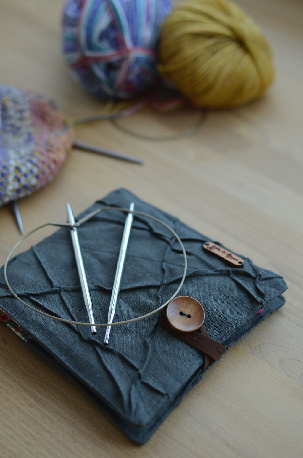 Travel knitting needle holder that carries all your knit necessities and more. Perfect summer vacation knitting bag.