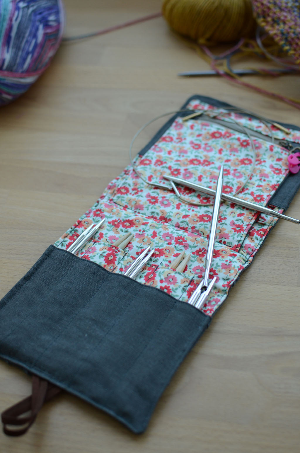 Travel knitting needle holder that carries all your knit necessities and more. Perfect summer vacation knitting bag.